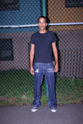 “crossed” jeans