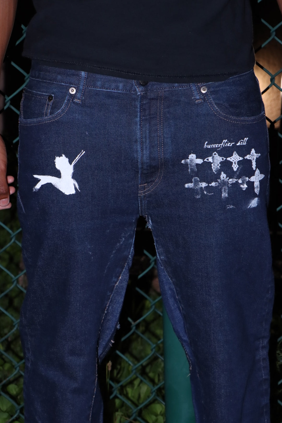 “crossed” jeans